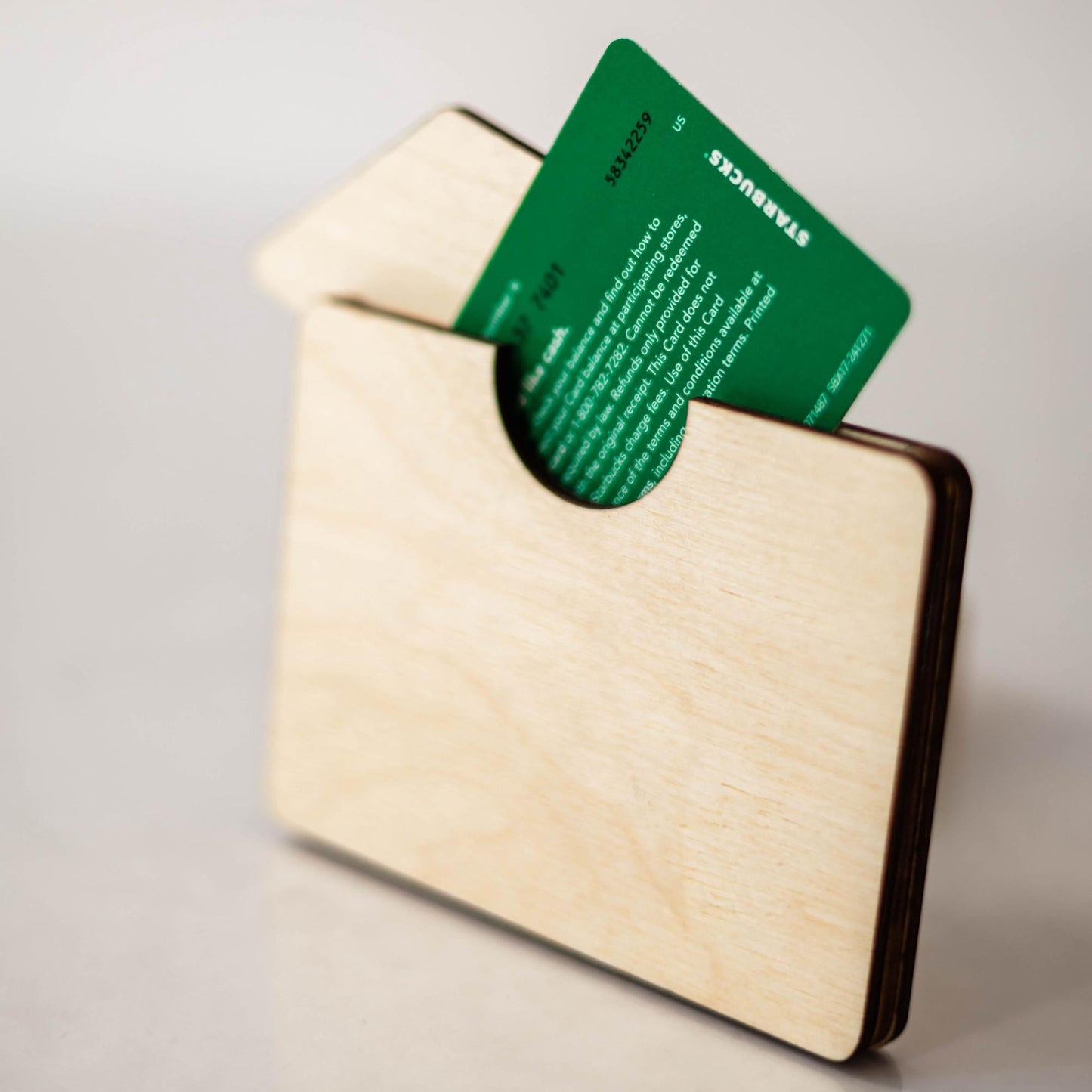 A wooden graduation gift card holder with a blue graduation cap design, featuring text accents such as 'You Did It' and 'Congrats Grad'.